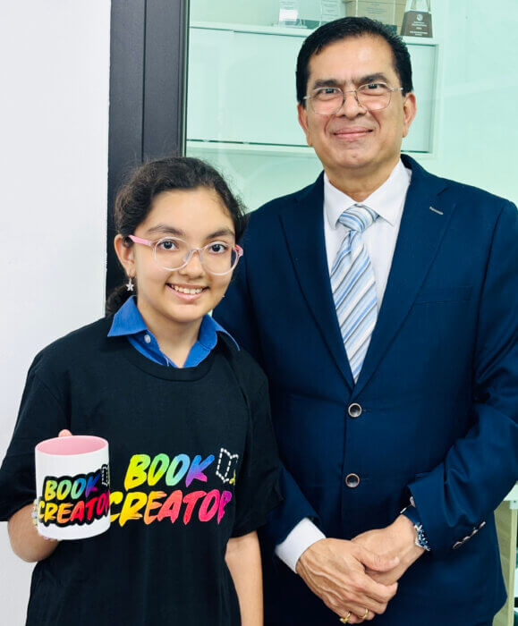 Nityashree Arora prize winner for the " Tell your Story " Competition with her prizes along   with , our beloved Senior Principal Dr Kris Bhatt .NPS international School Singapore to 